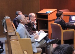 Scientology attorneys watch other Scientology attorneys in the courtroom