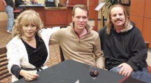 Karen de la Carriere and Jeff Augustine recently met with Vance Woodward (center)